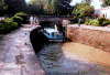 Rental boat locks through the Canal du Midi.